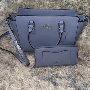 Fairly new baby blue coach bag! Comes with matching wallet🩵